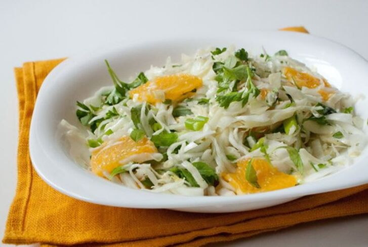 Chinese cabbage, orange and apple salad a vitamin dish in a low carbohydrate diet